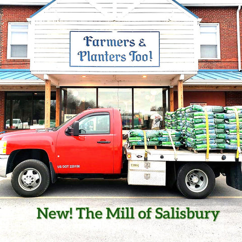 The Mill of Salisbury store front with a feed delivery truck